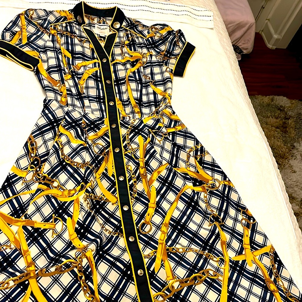 Beautiful, classy, demure! Silk and fully lined with beautiful buttons